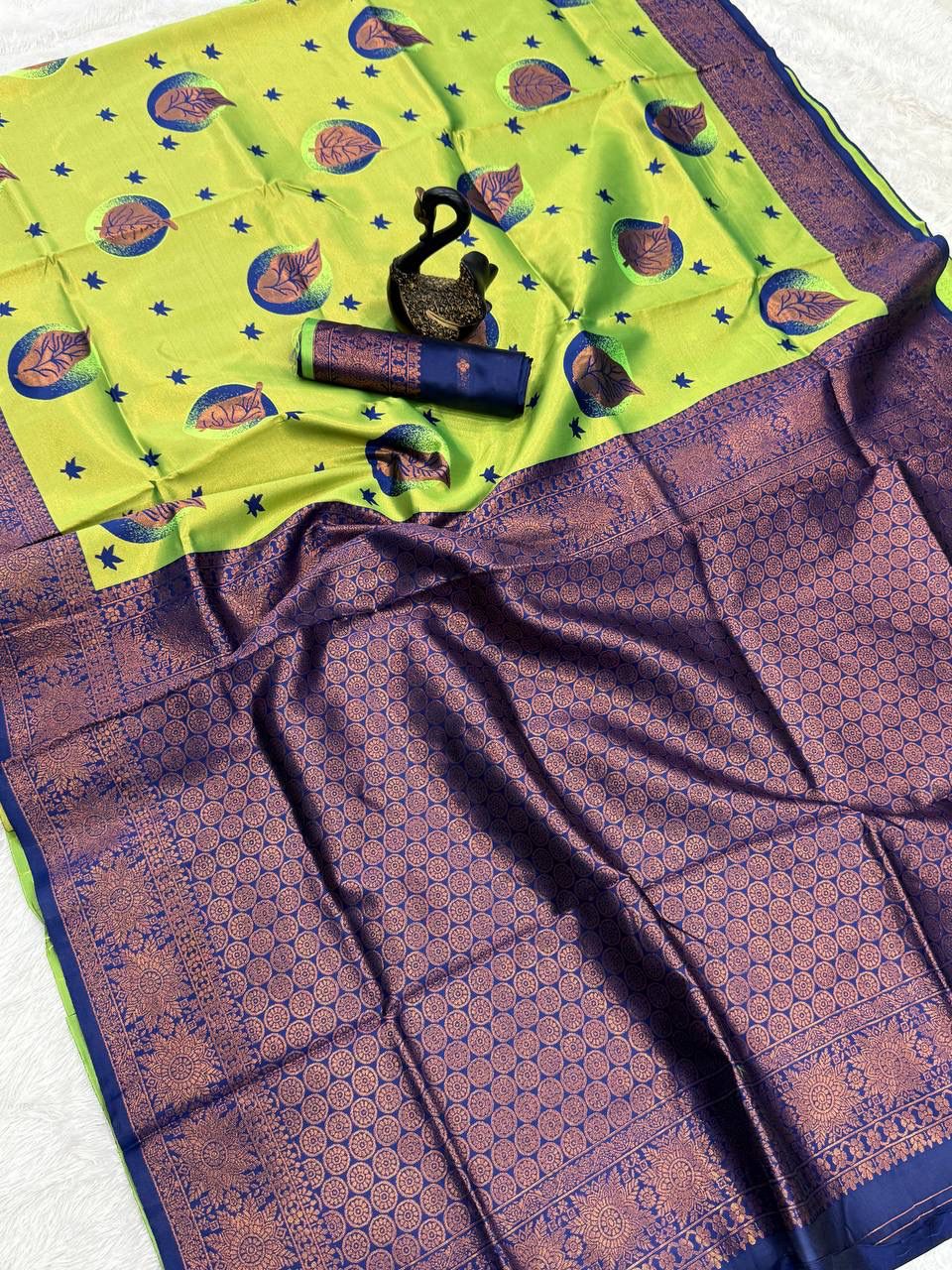 Tantalizing Parrot Soft Silk Saree With Assemblage Blouse Piece