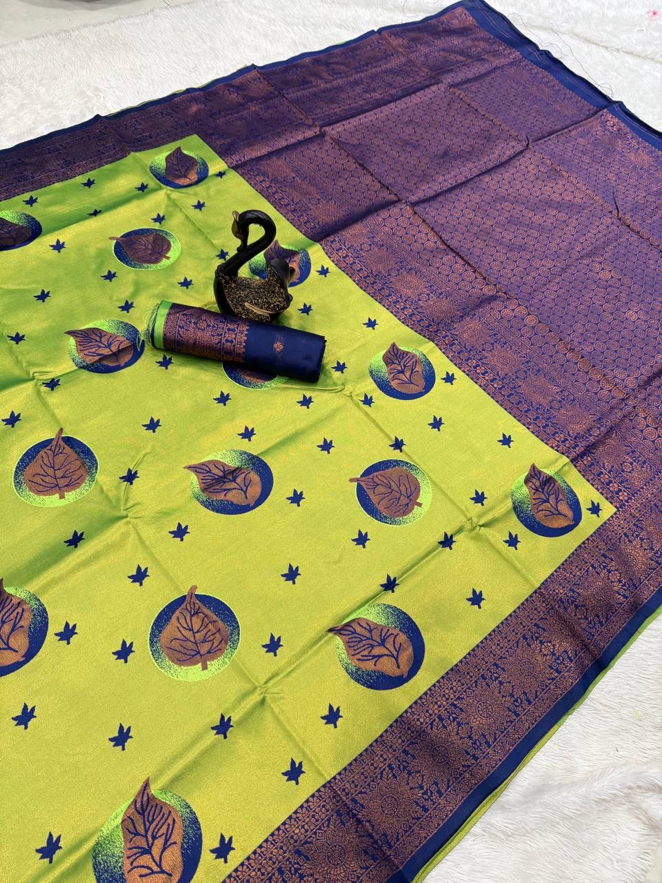 Tantalizing Parrot Soft Silk Saree With Assemblage Blouse Piece