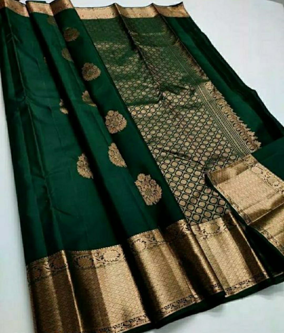 Ethnic Dark Green Soft Silk Saree With Exceptional Blouse Piece