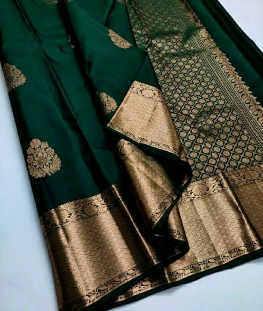 Ethnic Dark Green Soft Silk Saree With Exceptional Blouse Piece