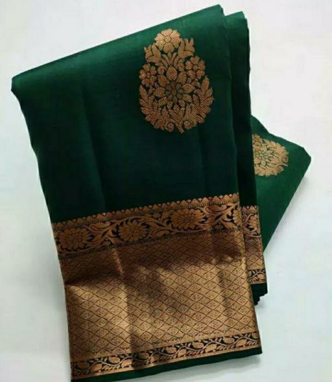 Ethnic Dark Green Soft Silk Saree With Exceptional Blouse Piece