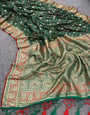 Hypnotic Dark Green Soft Banarasi Silk Saree With Resplendent Blouse Piece