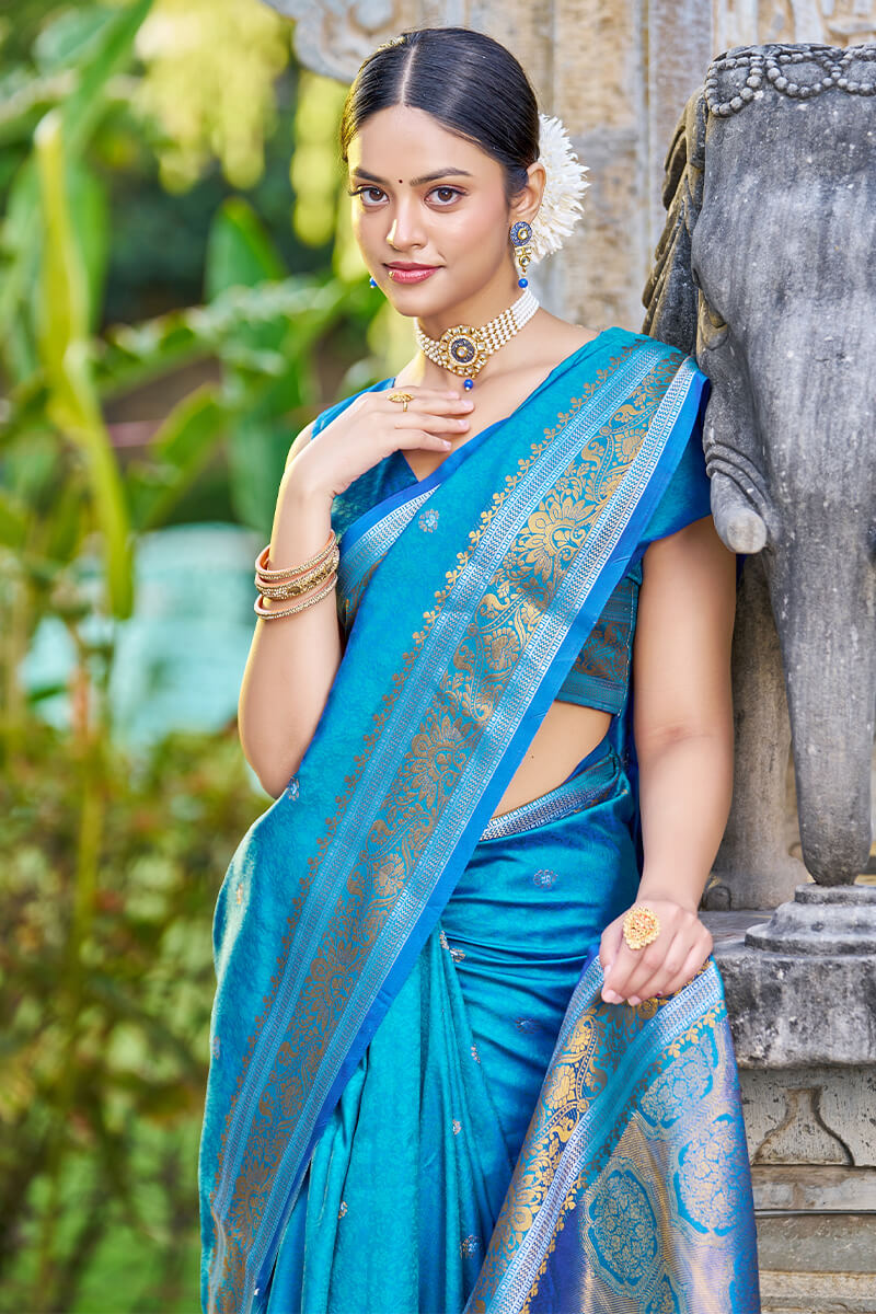 Blooming Firozi Kanjivaram Silk Saree With Traditional Blouse Piece