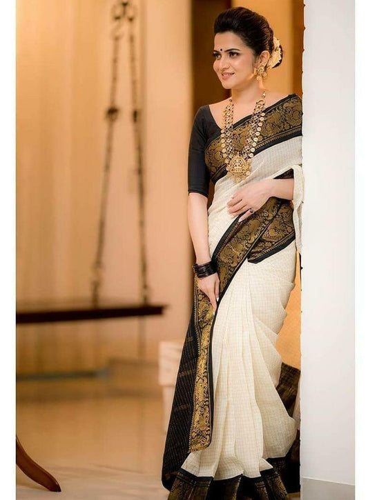 Twirling Off White Soft Banarasi Silk Saree With Panoply Blouse Piece