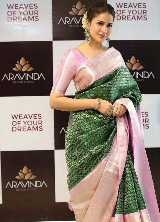 Elaborate Dark Green Soft Silk Saree With Redolent Blouse Piece
