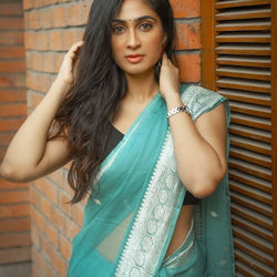 Blissful Firozi Soft Silk Saree With Brood Blouse Piece