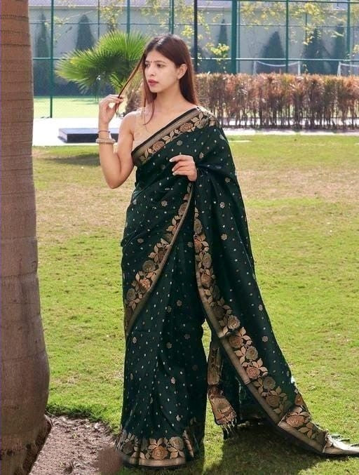 Embrocation Dark Green Soft Banarasi Silk Saree With Elision Blouse Piece