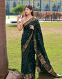 Embrocation Dark Green Soft Banarasi Silk Saree With Elision Blouse Piece
